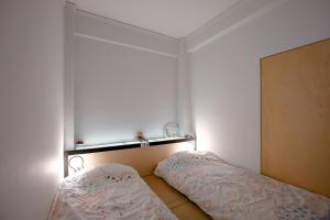 A bed or beds in a room at Semedaki, a modern appartment in the centre of history