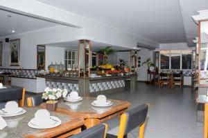 En restaurant eller et andet spisested på Hotel das Palmeiras