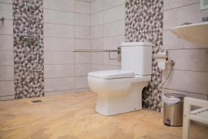 a bathroom with a toilet and a sink at Calle Lanzarote 29C in Playa del Ingles +15 photos