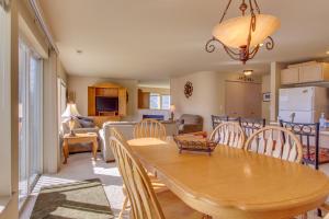 a dining room and living room with a table and chairs at Park Pointe Condominiums in Chelan