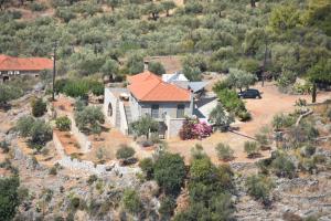 an aerial view of a house in a field at Athina's Stone House in Kardamyli in Kardamili