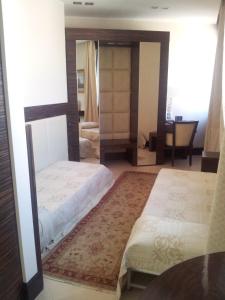 Postel nebo postele na pokoji v ubytování Hotel Excelsior