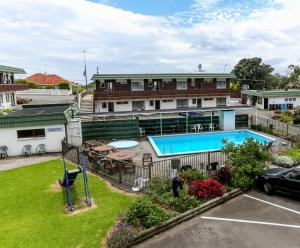 an aerial view of a building with a swimming pool at Flamingo Motel in New Plymouth