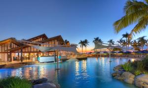 a resort with a pool in front of a building at Radisson Blu Resort Fiji in Denarau