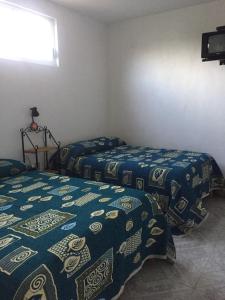 Krevet ili kreveti u jedinici u okviru objekta Hotel Lienzo Charro II