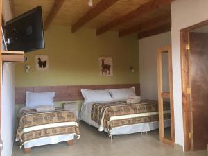 Voodi või voodid majutusasutuse Hostal Pablito 2 toas