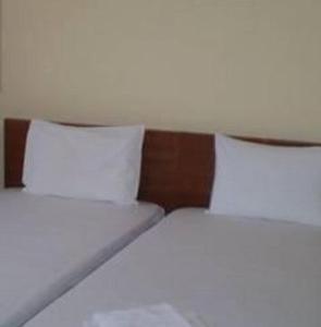 Postel nebo postele na pokoji v ubytování Hotel Apolafsi
