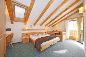 Katil atau katil-katil dalam bilik di Hotel Malga Passerella