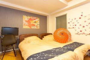 En eller flere senger på et rom på Miyabiro 107