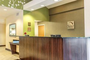 a hotel lobby with a sign on the wall at Sleep Inn & Suites North Augusta in North Augusta