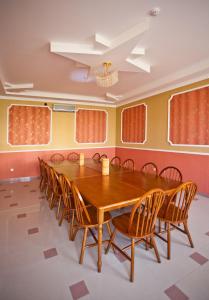 a conference room with a wooden table and chairs at Гостевой дом Парадиз Resort in Sudak