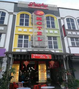 a store front of a building with a sign on it at Lucky Hotel in Sungai Petani