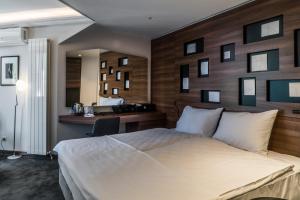 Postel nebo postele na pokoji v ubytování Best Western Premier Natalija Residence