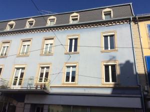 a white building with a lot of windows at LE THIERS in Belfort
