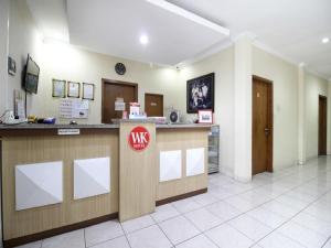 a lobby of a hospital with a reception counter at RedDoorz Plus near Stadion Mandala Krida in Yogyakarta