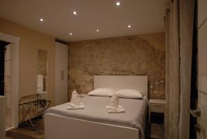 Posteľ alebo postele v izbe v ubytovaní Elegant Residence Rooms + 9 fotografií