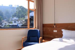 Hangzhou Moju Boutique Guesthouse at the West Lake客房内的一张或多张床位