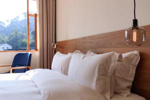 Hangzhou Moju Boutique Guesthouse at the West Lake客房内的一张或多张床位