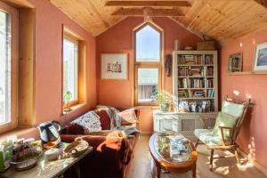 a living room with a couch and a table at Kenmare Eco Lodge in Kenmare