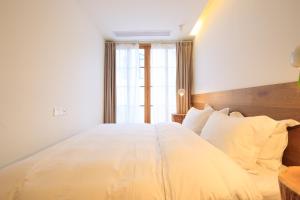 Hangzhou Moju Boutique Guesthouse at the West Lake客房内的一张或多张床位