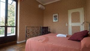 Postel nebo postele na pokoji v ubytování Villa Cornarea