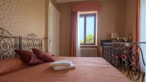 Postel nebo postele na pokoji v ubytování Villa Cornarea