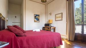 Postel nebo postele na pokoji v ubytování Villa Cornarea