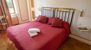 Postel nebo postele na pokoji v ubytování Villa Cornarea