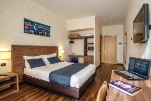מיטה או מיטות בחדר ב-Hotel Roma Sud