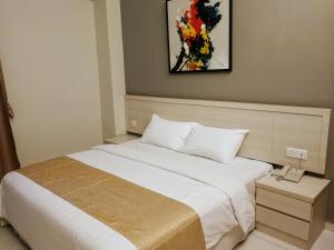 Postel nebo postele na pokoji v ubytování Aurora Hotel