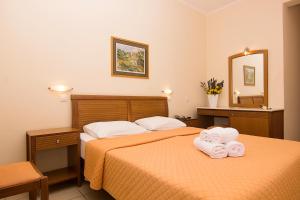 Postel nebo postele na pokoji v ubytování HOTEL STOUPA