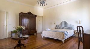 Postel nebo postele na pokoji v ubytování Villa Cornarea