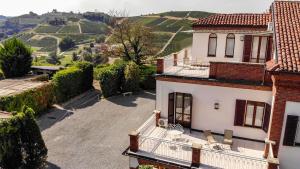 an aerial view of a house with the hills in the background at Villa Cornarea in Canale