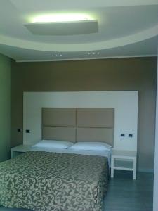 Postel nebo postele na pokoji v ubytování Hotel L'Approdo