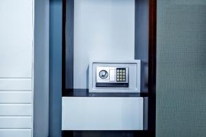 a microwave sitting on a shelf in a room at Parallel Hotel in Baku
