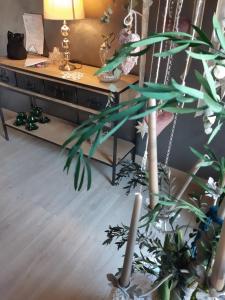 a living room with a desk and a plant at DormidaNoi in Civitanova Marche