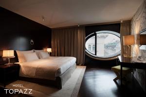 Postel nebo postele na pokoji v ubytování Hotel Topazz & Lamée