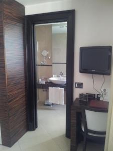 Kuchyň nebo kuchyňský kout v ubytování Hotel Excelsior