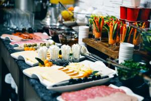 a buffet with many plates of food on a table at Parallel Hotel in Baku