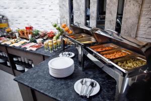 a buffet line with many different types of food at Parallel Hotel in Baku