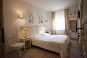 Letto o letti in una camera di Relais in Contrada