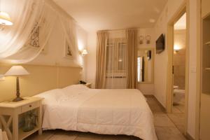 Letto o letti in una camera di Relais in Contrada