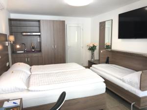 Postel nebo postele na pokoji v ubytování Hotel König