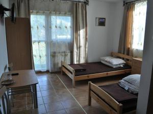 Posteľ alebo postele v izbe v ubytovaní Jasionka 2