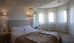 Letto o letti in una camera di Relais in Contrada