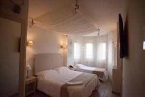 Letto o letti in una camera di Relais in Contrada