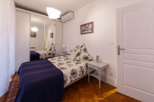 Un ou plusieurs lits dans un hébergement de l'établissement Light and airy apartment in the Old Nice