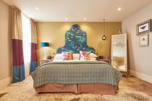 A bed or beds in a room at Seaham Hall and Serenity Spa