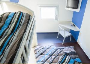 Postel nebo postele na pokoji v ubytování ENZO Hotels 1er PRIX