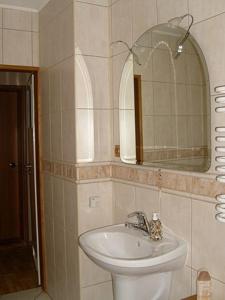 a bathroom with a sink and a mirror at FitoSfera Inez in Jastarnia +35 photos